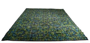 20th Century Axminster rug, in blue and green with abstract motifs, label to reverse, 354cm x 273cm