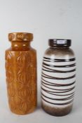 Two west German vases one of dark stripe colourings the other of orange and a onion like design 41cm