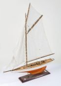 Model of a sailing Yacht, single mast raised on a stand