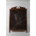 Arts and Crafts copper panel, repousse chased with an owl, housed within an oak frame, 46cm wide x