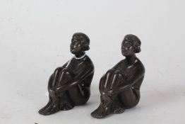 Pair of Art Deco spelter figures, each in the form of a seated lady, with registration marks, each