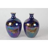 Pair of Devon Lustrine Fielding's vases, Summer pattern, the bulbous bodies brightly decorated