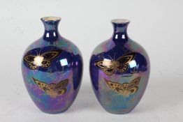 Pair of Devon Lustrine Fielding's vases, Summer pattern, the bulbous bodies brightly decorated