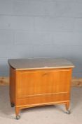 20th century teak cocktail cabinet, having sliding top, the drop front enclosing an interior for