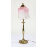 Brass table lamp with a shaped mottled glass shade in pink and white, 54cm high