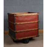 20th century wooden and metal bound mill trolley, raised on four large wheels, 77.5cm wide x 64.