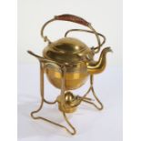 Arts and Crafts design Bavarian brass spirit kettle on stand, having wicker carrying handle, the