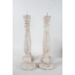 Four shabby chic pricket sticks, with tapering columns and circular feet, all approx. 45cm tall (4)