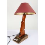 Novelty table lamp created out of the stock of a rifle, with an insignia to the base, 39cm high