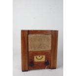 A.C. wartime civilian receiver, housed within a wooden case, with instruction label to the back,