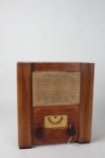 A.C. wartime civilian receiver, housed within a wooden case, with instruction label to the back,