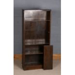 1920/30s oak veneered bookcase, with five adjustable shelves, raised on a plinth base, 61cm wide and