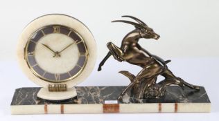 Art Deco style mantel clock, the dial with a white onyx surround and Roman numerals, flanked by a