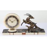 Art Deco style mantel clock, the dial with a white onyx surround and Roman numerals, flanked by a