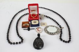 Collection of costume jewellery to include a whitby jet pendant, black bead necklace and a yellow