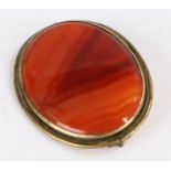 Agate brooch with a brass surround 5.5cm long