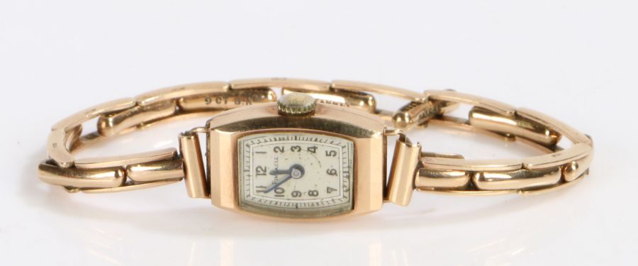 Pinnacle 9 carat gold cased ladies wristwatch, the signed silver dial with Arabic markers and