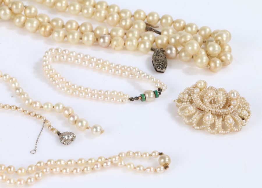 Collection of simulated pearls to include necklaces, bracelets and a brooch formed out of pearls (