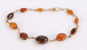 18 carat gold and amber set bracelet, with graduated amber beads, 19.5cm long