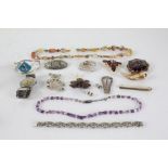 Collection of costume jewellrey to include brooches, necklaces, and a watch (Qty)