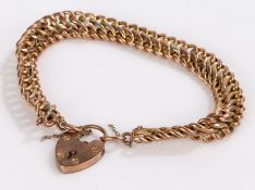 9 carat gold bracelet, with figure-of-eight form links united by a heart form clasp, 14.2g