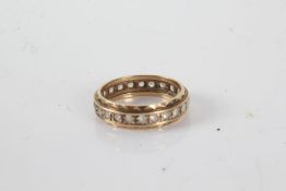 9 carat gold eternity ring set with clear paste, ring size P, 3g