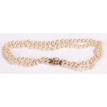 Simulated pearl necklace with a 9 carat gold clasp and two rows of pearls