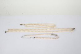 Simulated pearl necklace with a silver clasp together with two other pearl necklaces (3)