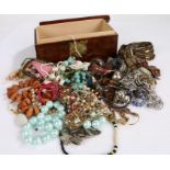 Collection of costume jewellery to include necklaces, bracelets and a watch housed in wooden box (