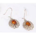 A pair of amber earrings mounted on silver