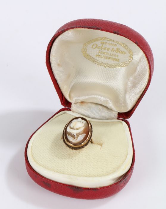 9 Carat Gold ring set with a cameo depicting a flower housed in a box, gross weight 4.2g
