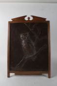 Arts and Crafts copper panel, repousse chased with an owl, housed within an oak frame, 46cm wide x