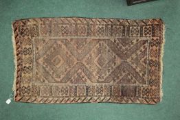 Middle eastern style rug, with a Greek key border with a floral decoration the center, 65cm long