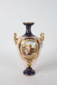 Royal Bonn porcelain twin handled vase, of ovoid form, the gilt floral neck on dark blue ground