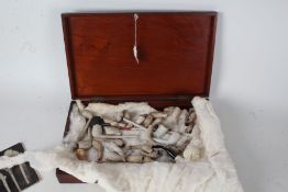 Collection of clay pipes and pipe bowls, to include example in the form of a mile marker, small book