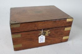 Victorian mahogany and brass bound writing, the lid with vacant scrolled cartouche, the interior