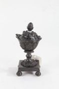 Regency bronze pastille burner, the foliate cast pierced lid above a wavy rim and acanthus leaf cast