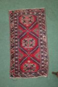 Middle eastern style rug the blue and red coulourings with a diamond border and three central