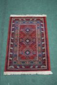 Middle eastern style rug made in Belgium, the red and blue multiple border's with three central