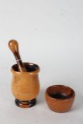 Lignum vitae pestle and mortar, the mortar of elongated form and stepped foot together with the