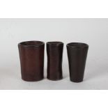 Three leather dice shakers, of tapering form (3)