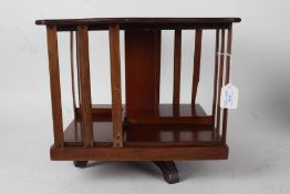 Edwardian mahogany table top revolving bookcase, 37cm square, 33cm high