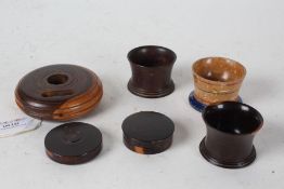 Collection of treen, to include two lignum vitae seal cases, two lignum vitae salts, a painted