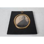 Victorian portrait miniature, depicting a gentleman in profile, housed in a gilt mount and