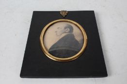 Victorian portrait miniature, depicting a gentleman in profile, housed in a gilt mount and