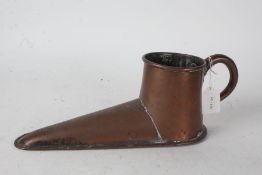 Copper ale muller in the form of a shoe, with loop handle, 37cm long