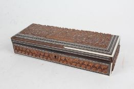 Indian sandalwood and ivory mounted box, the hinged lid carved in relief with a building, animals