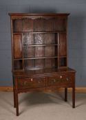 18th century style oak dresser, the plate rack having a pair of mahogany crossbanded doors with