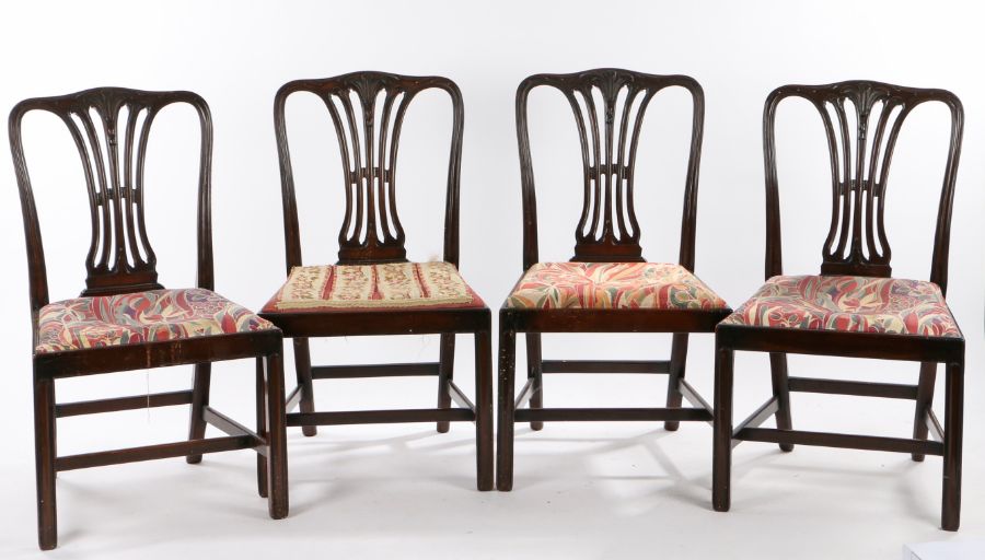 Set of four mahogany dining chairs, in the George III manner, with a prince of Wales feathers carved