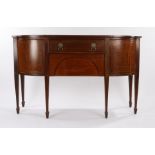 19th Century mahogany and crossbanded sideboard, the rectangular top with bowed corners above two